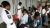 FILE - Cholera patients drink treated water inside an admission ward at Budiriro Polyclinic in Harare, Zimbabwe.