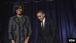 Presiden Barack Obama dan Michelle Obama saat tiba pada acara 'National Prayer Breakfast' di Washington, Kamis (3/2).