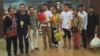 The three activists and their families stand in front of a prison in Koh Kong province on July 1, 2016. (Photo provided by Licadho) 