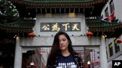 Emerson College student Frances Hui poses in the Chinatown neighborhood of Boston, Oct. 2, 2019. Hui, of Hong Kong, faced threatening language from classmates from mainland China after she published a column, "I am from Hong Kong, not China."