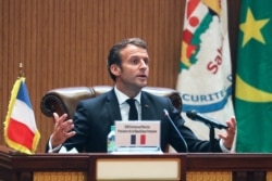 FILE - French President Emmanuel Macron speaks during the closing press conference at the G5 Sahel summit on June 30, 2020, in Nouakchott.