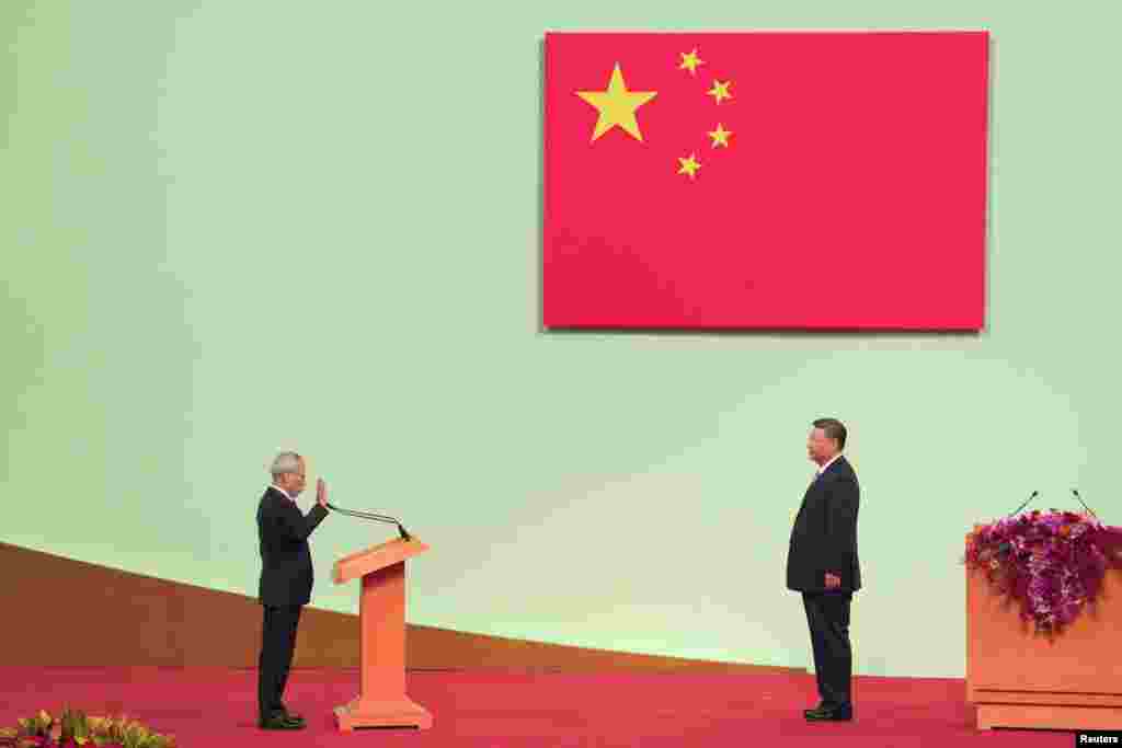 Macau’s new Chief Executive Sam Hou-fai is sworn in by China’s President Xi Jinping during an inauguration ceremony as part of 25th anniversary handover celebrations in Macau.
