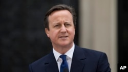 British Prime Minister David Cameron at 10 Downing Street in London, as he makes a speech after arriving back from visiting Britain's Queen Elizabeth II, March 30, 2015.