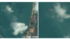 A January 16 satellite image from commercial provider Maxar shows two clamshell dredgers just off the coast of Ream accompanied by barges for collecting the dredged sand. (Courtesy screenshot of CSIS website)