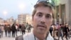 FILE - This undated file still image from video released April 7, 2011, by GlobalPost, shows James Foley of Rochester, N.H., a freelance contributor for GlobalPost, in Benghazi, Libya.
