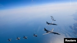 FILE PHOTO: US Air Force B-1B bombers, F-16 fighter jets and South Korean Air Force F-35A take part in a joint air drill