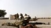 Fuerzas de seguridad iraquíes demuestran sus habilidades en una ceremonia de graduación en Camp Taji, una base del ejército iraquí en Bagdad, el 21 de febrero de 2016. Reuters.
