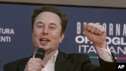 File - Tesla CEO Elon Musk in Rome, Dec. 16, 2023. A judge says Elon Musk must give up a compensation package awarded by Tesla's board of directors that is potentially worth more than $55 billion. 