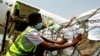 FILE - A shipment of COVID-19 vaccines distributed by the COVAX global initiative arrives in Abidjan, Ivory Coast, Feb. 25, 2021.