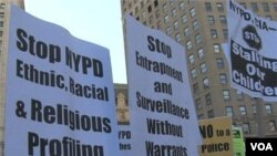 Signs carried by protesters call for end to spying.