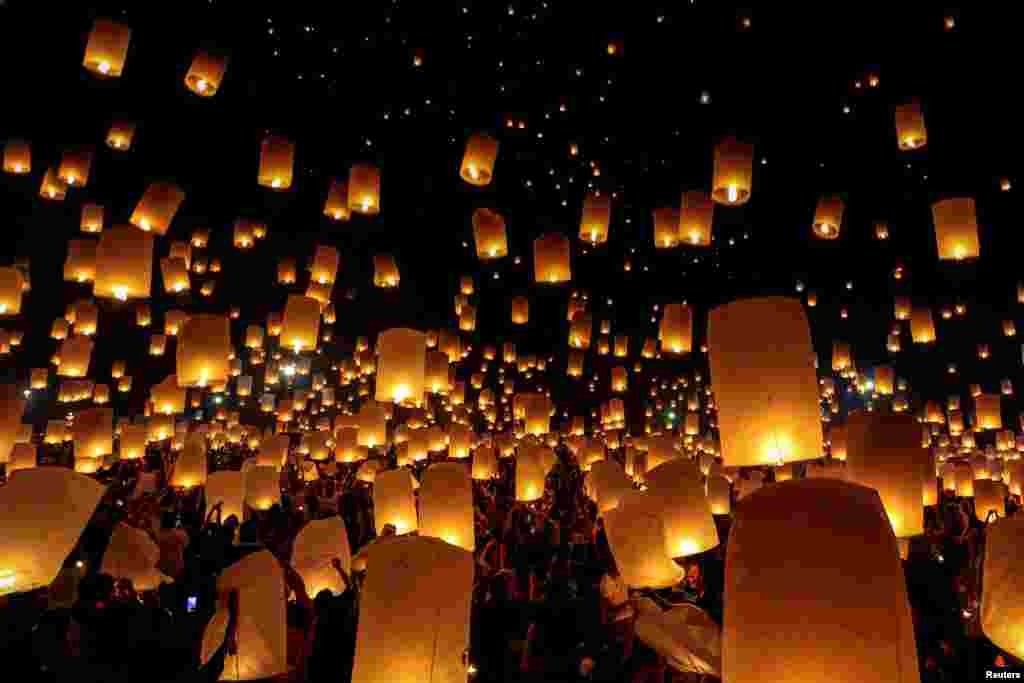 People release floating lanterns during the festival of Yee Peng in the northern capital of Chiang Mai, Thailand.