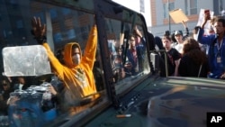 Protesters stand near a Minnesota National Guard vehicle Friday, May 29, 2020, in Minneapolis.