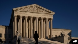 The Supreme Court is seen at sundown on the eve of Election Day, in Washington, Nov. 2, 2020.