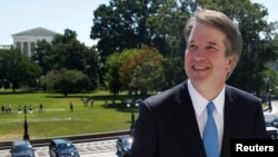 FILE - With the U.S. Supreme Court building in the background, Supreme Court nominee judge Brett Kavanaugh arrives for meetings with lawmakers on Capitol Hill in Washington, July 10, 2018. 