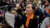 A supporter of Thailand's Future Forward Party cries as she watches a live television broadcast of a court verdict at the party's headquarters in Bangkok, Thailand, Feb. 21, 2020. 
